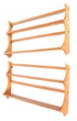 A pair of Ercol mid-century golden dawn plate racks.
