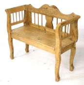 A contemporary pine bench.