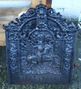 A cast iron fire back.