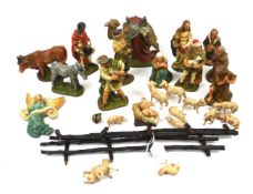 A vintage polychrome terracotta Nativity set. Including a camel, a donkey, a bull and sheep, etc.