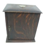 A vintage wooden table top smoker's cabinet.