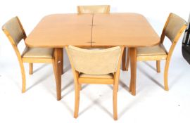 A mid-century Maples of London folding dining table and four matching chairs.