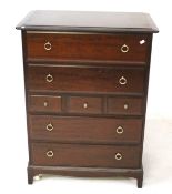 A contemporary mahogany chest of drawers.