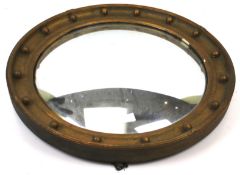 A circular wall mirror.