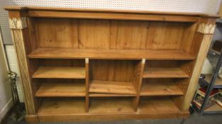 A pine set of freestanding shelves.