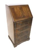 A small fall front bureau.