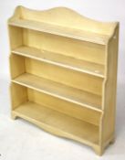 A 20th century waterfall freestanding bookcase.