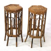A pair of bamboo plant stands.
