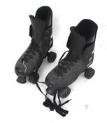 A pair of vintage Roces roller skates.