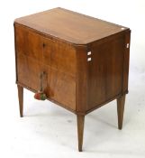 A vintage wooden chest of drawers.