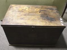 A vintage mahogany blanket box and contents.