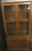 A teak display cabinet.