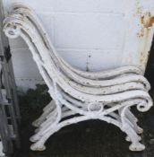 Two pairs of cast metal bench ends.