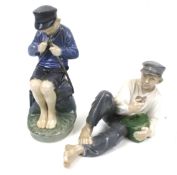 Two Royal Copenhagen ceramic figures.