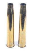 A pair of WWII British six pound 1947 brass shell cases. Dated 1942. Circa H43.