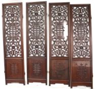 An oriental hardwood four panel screen. With pierced decoration.