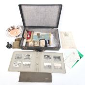 A collection of medals and military service paperwork.