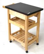 A contemporary pine food trolley.