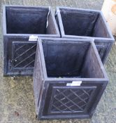 Three contemporary cast metal plant pots.