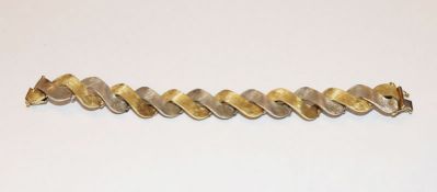 14 k Weiß- und Gelbgold Armband in verschlungener Form, mattiert, 38 gr., L 17 cm