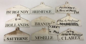 A collection of Wedgwood porcelain wine tags including 