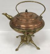 A copper and brass kettle on stand by Benson, the stand stamped 