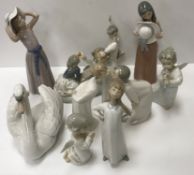 A collection of twelve various Lladro figures including 