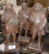 Three mid 20th Century carved wooden figures depicting Boswell inscribed 