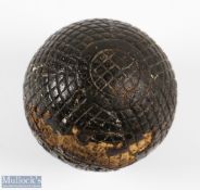 The Ocobo 27.5 mesh pattern gutty Golf ball showing slight distress to the cover devoid of paint but