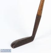 Brown Vardon patent metal headed putter showing the Gibson Star mark to the crown of the small