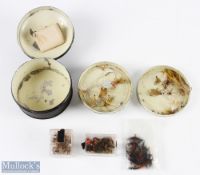 A round, unnamed black japanned cast tin with 2 lift out trays containing a selection of mayflies,
