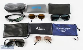 A collection of Sunglasses: Snowbee Polarised wrap with cleaning cloth and lanyard, in hard case