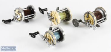 A collection of Mitchell multiplier reels, all working: 2x 600 Model One, with rod clamp; 1x 602 and
