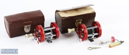 2x ABU Ambassadeur 6000 Multiplier Reels both in red, both run smooth in good used condition, both