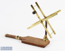 C Farlow brass folding line dryer on wood base, spring loaded arms on a steel shaft and brass