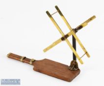 Army & Navy folding brass line winder/dryer on wood base with reel fittings