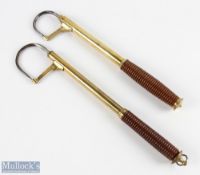 Army & Navy brass 2 draw salmon gaff with folding point guard and turned wood handle; unnamed