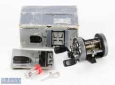 Daiwa Millionaire 6HM Multiplier Reel in grey finish with tool, spare parts tube and paperwork, runs