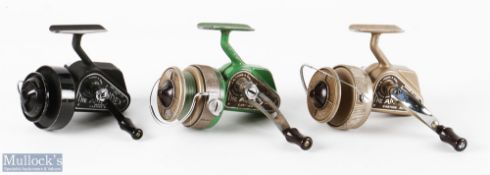 3x J W Young Ambidex Casting Reels - one in green / brown colour, one brown and the other in black