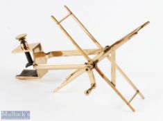 A large brass folding line winder/dryer with large C clamp, strait crank handle and arm with folding