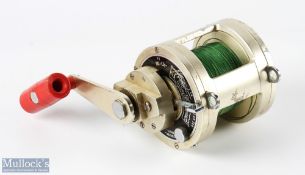 Modena, Italy Gladiator 50lb Multiplier Big Game Reel in champagne colour finish with large red