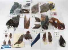 A collection of unused complete skins and selected wing feathers - partridge, starling, Amhurst
