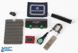 A collection of fishing gadgets, to include: C&F double zinger with Orvis nippers and hook
