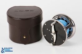 A fine Loop 811 salmon reel No 37, RHW, counter balanced handle, constant check, stainless steel