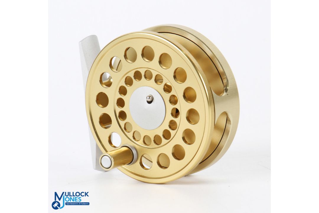 A fine Marryat Swiss made 2 5/8" fly reel with gold finish, button latch, rear tensioner, RHW, in - Image 1 of 2