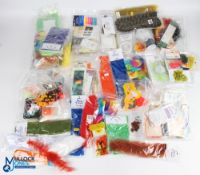 A collection of synthetic fly tying material - synthetic quills, eyes, body tube, numph bodies,