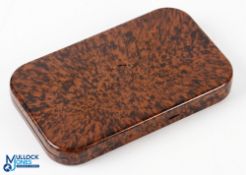 Vintage Neroda Fly Box with mottled brown finish exterior, with a small selection of flies inside,