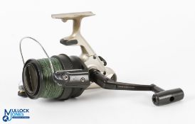 Daiwa 5500T fixed spool spinning reel, good bail, coil spring loaded drag, runs very well, light