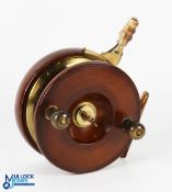 A fine example of a Nottingham style mahogany and brass star back sea reel, 6