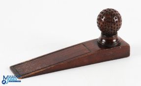 Fine Dark Stained Wooden Golf Ball Door Wedge comprising a large dimple golf ball mounted on a tee -